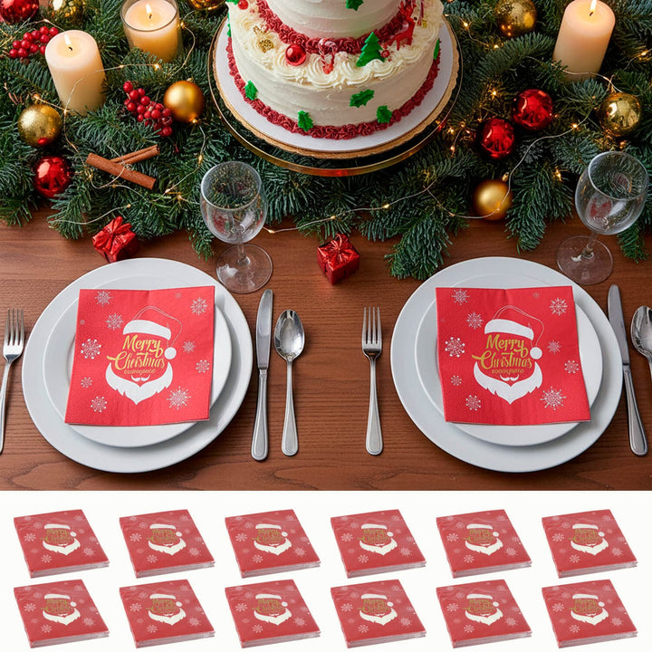 Christmas-themed table setting with a cake, candles, and red &