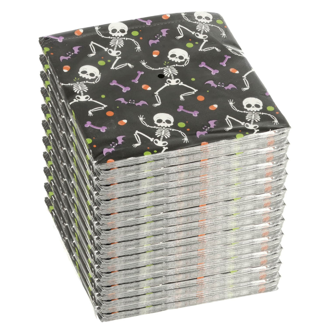 Stack of Halloween-themed napkins with skeletons and bones on a black background.