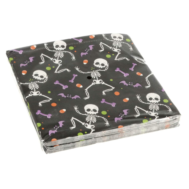 Pack of Halloween-themed paper napkins with skeletons and bones on a black background.