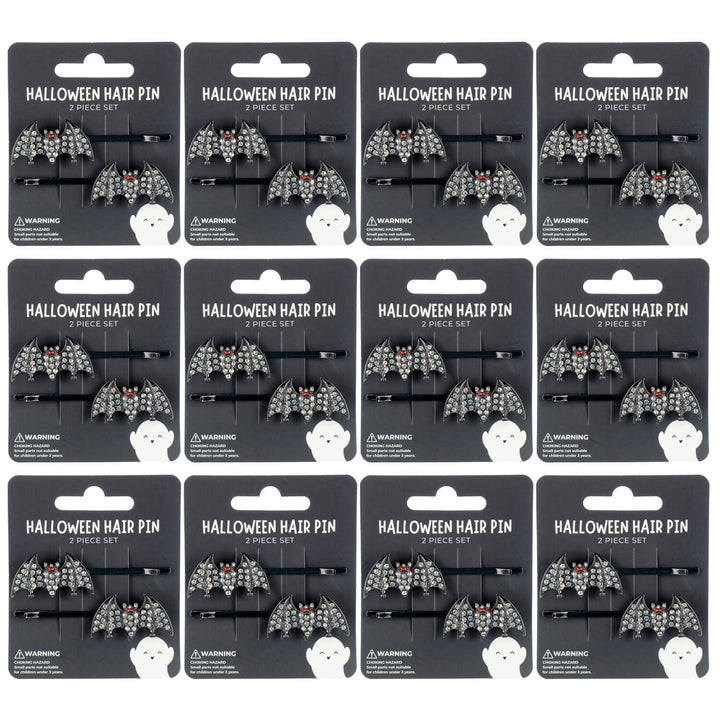 Packaging of Halloween bat hair pins with decorative designs on a white background.
