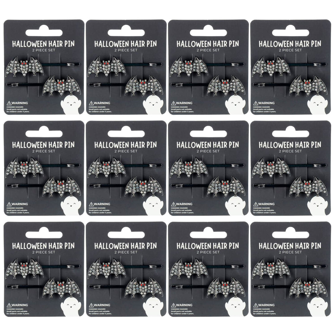 Packaging of Halloween bat hair pins with decorative designs on a white background.