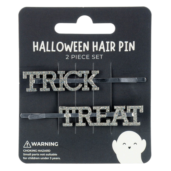 Halloween-themed hair pins with 'Trick' and 'Treat' diamante text on a black card packaging.