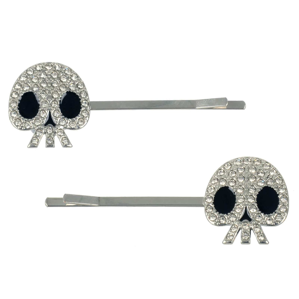 Set of 2 silver hair pins with skulls decorated with rhinestones on a white background