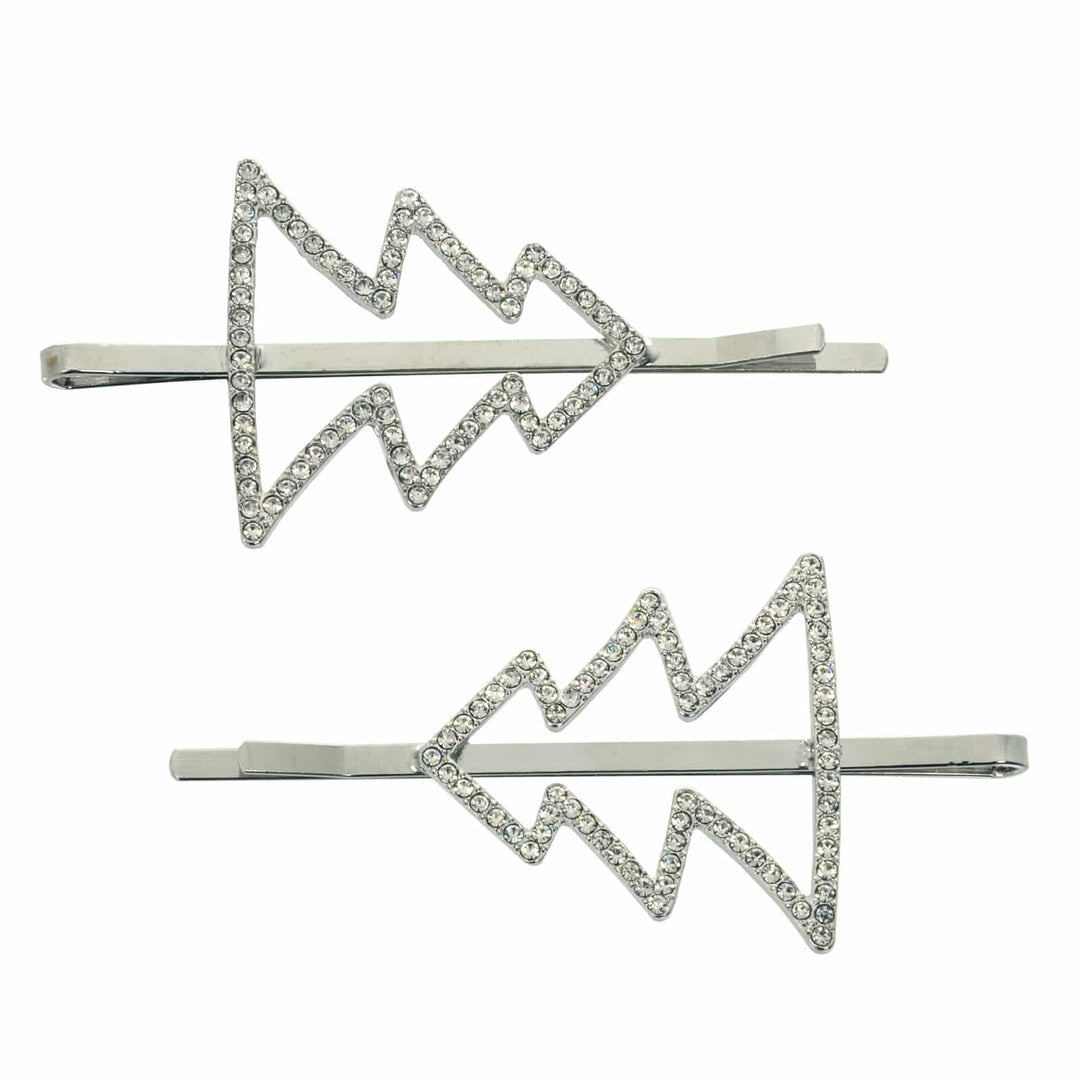 Set of 2 silver Christmas tree shape hair slides with sparkling diamante decoration on a white background