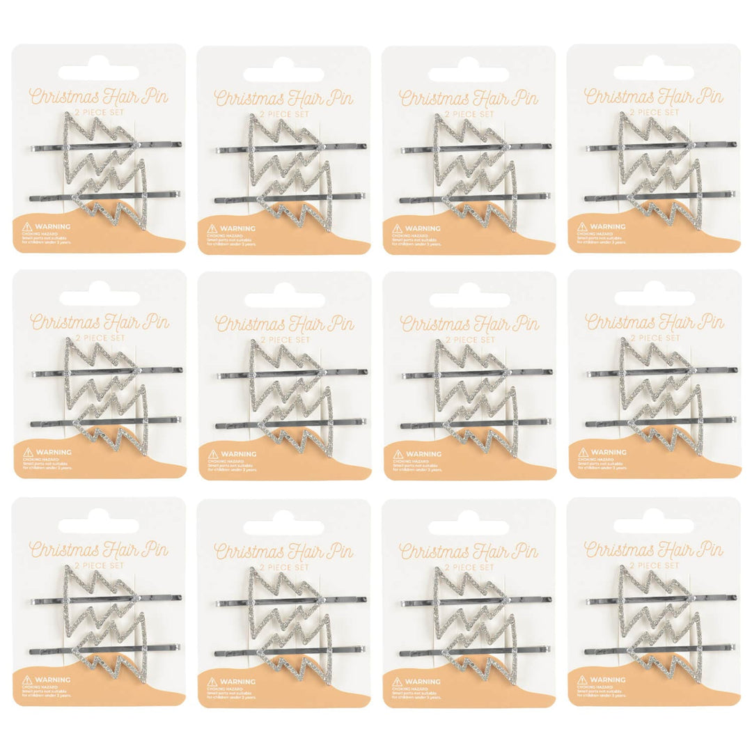 12 display cards of silver Christmas tree hair pins on a white background