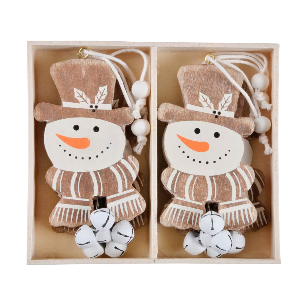 Wooden snowman Christmas tree decorations in a box on a white background