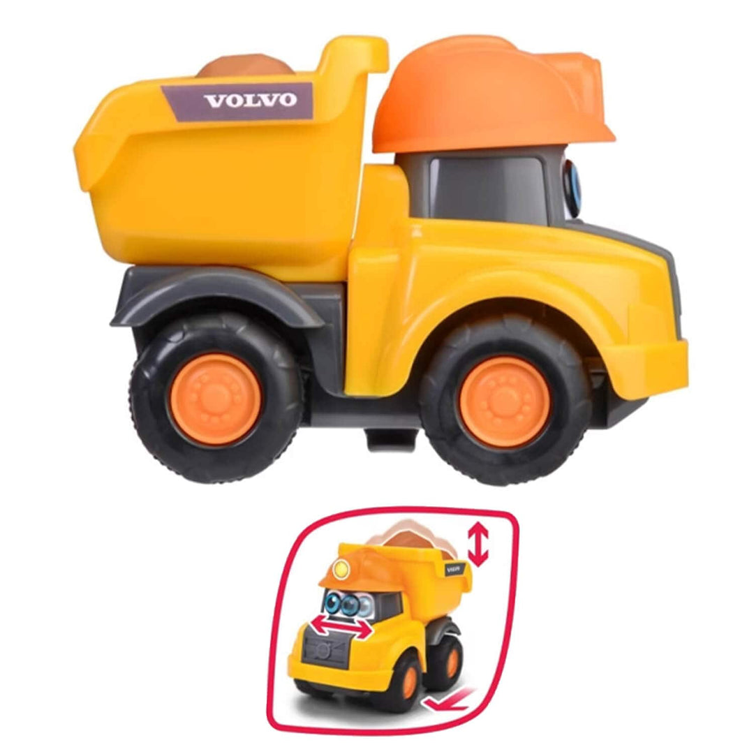 Yellow and orange toy tipper truck with a visible Volvo logo on the side, shown on a white background with a small inset diagram illustrating the tipper function.
