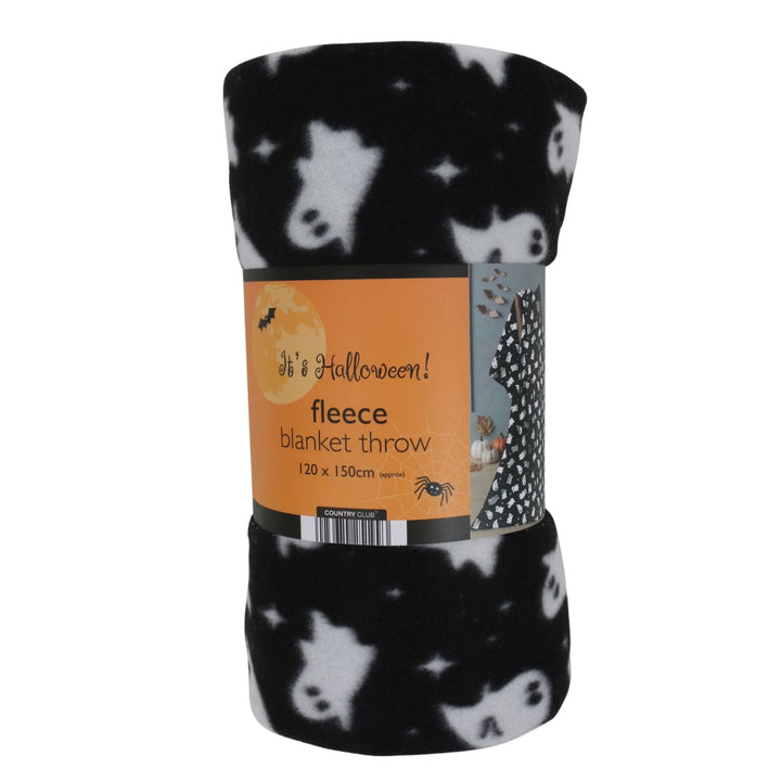 A rolled-up black fleece blanket throw with a white ghost pattern, wrapped in an orange paper label that reads 'Halloween! fleece blanket throw 120 x 150cm'.