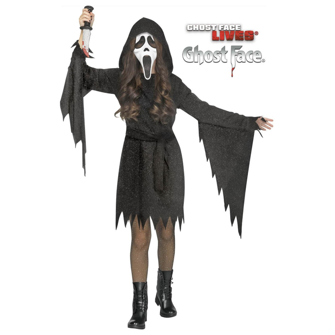 A child modelling a black glitter Ghost Face costume with white mask from the Scream movie franchise