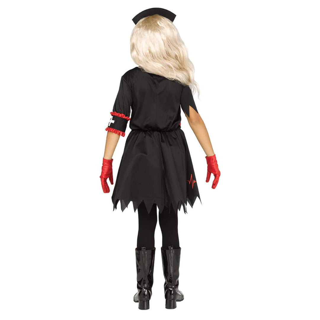 Back view of a child wearing a black dress with jagged edge hem and red gloves