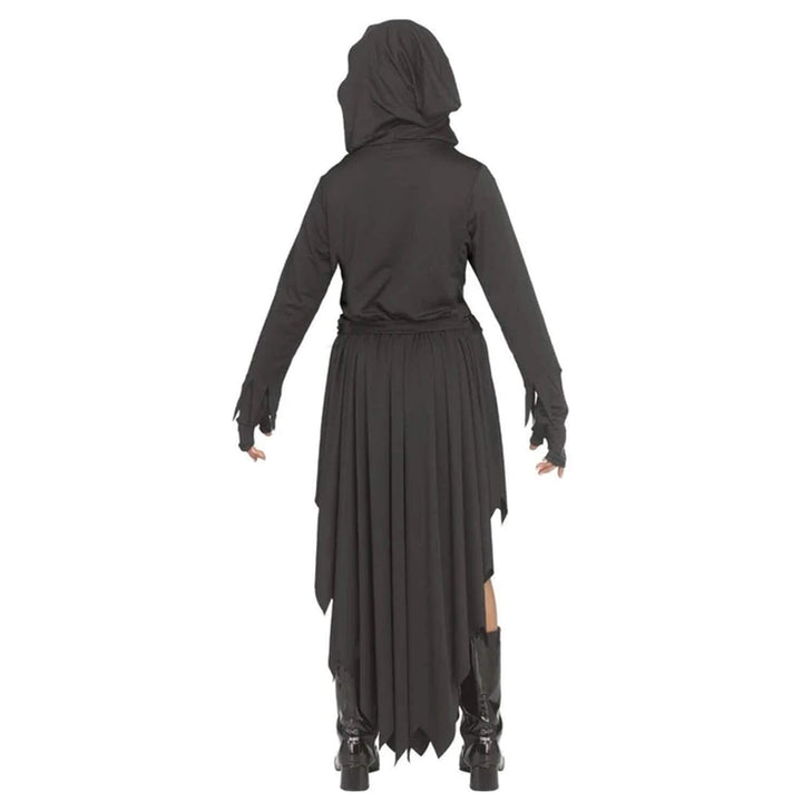 Back view of a girl wearing a long black hooded dress with shiny black boots on white background