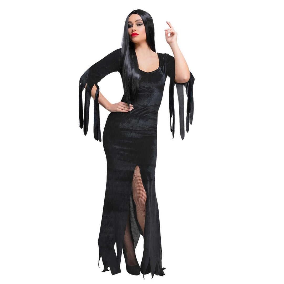 A woman modeling a black gothic-style dress with fringe details on the sleeves and hem, set against a plain white background.