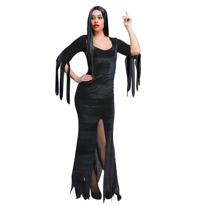 Woman wearing a black dress with long sleeves and a high slit on a white background
