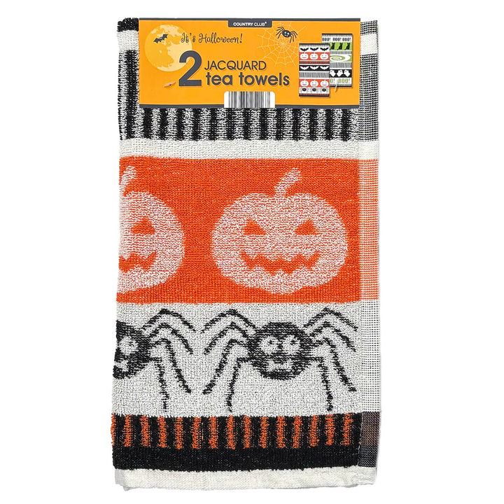 Two Halloween-themed jacquard tea towels with orange pumpkins and black spiders on a white and black striped background, packaged with an orange header card.