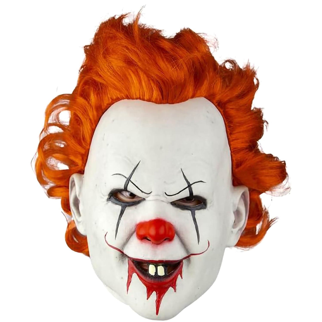 A Pennywise clown mask with bright orange hair, a white face, a red nose, and a blood-red stitched smile, shown against a plain white background.