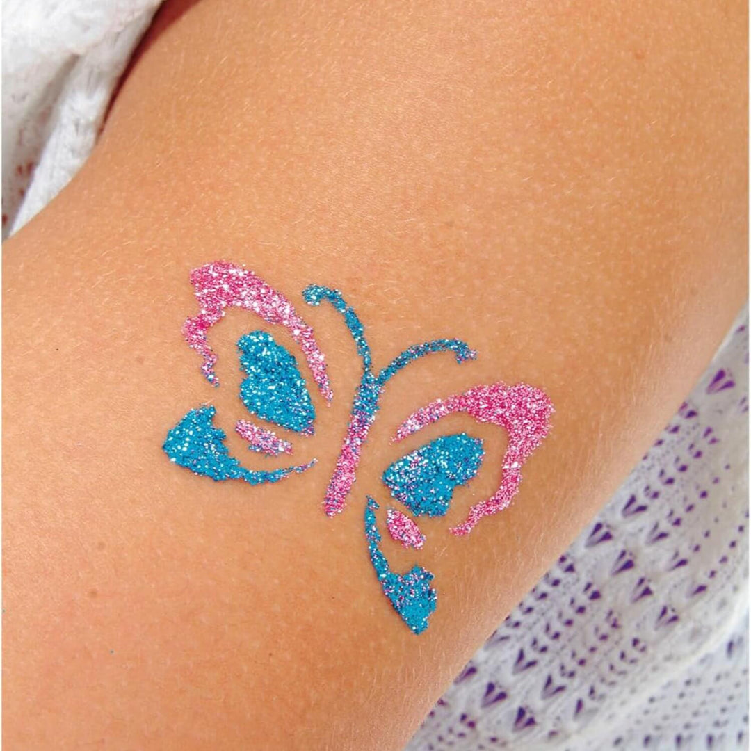 Blue and pink glitter butterfly tattoo on a person&