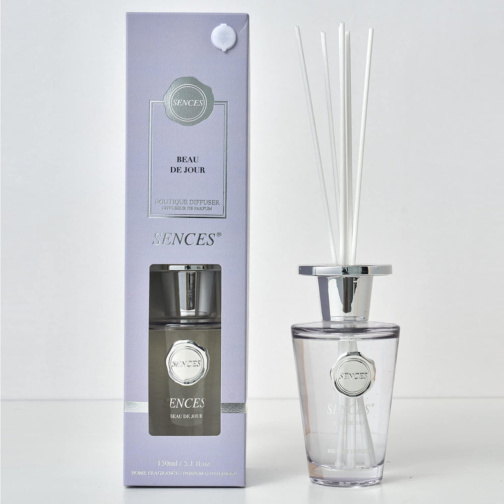 Sences Beau de Jour reed diffuser bottle and packaging with white reed and silver cap