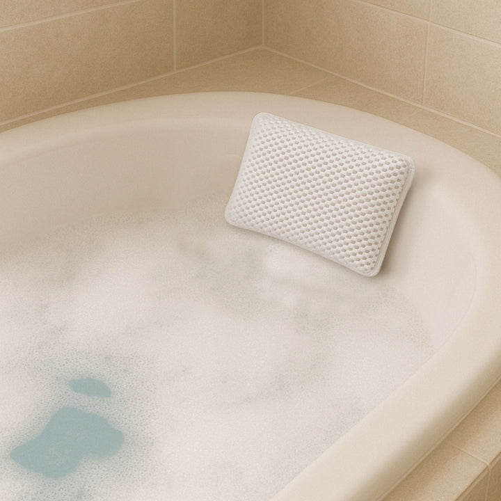 White foam pillow on a bathtub with bubble bath