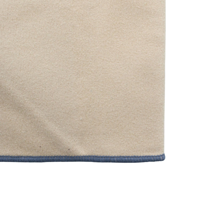 Close-up of car towel beige glass cleaning fabric with a grey stitched border on a white background