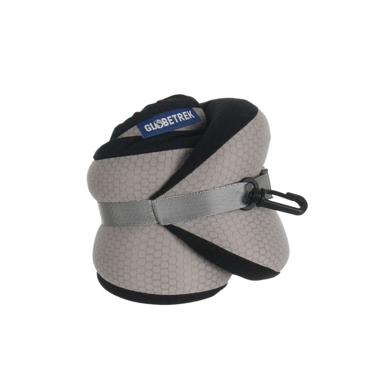 memory foam neck pillow rolled up into smaller size for storage on white background, brand tao and hanging clip visible
