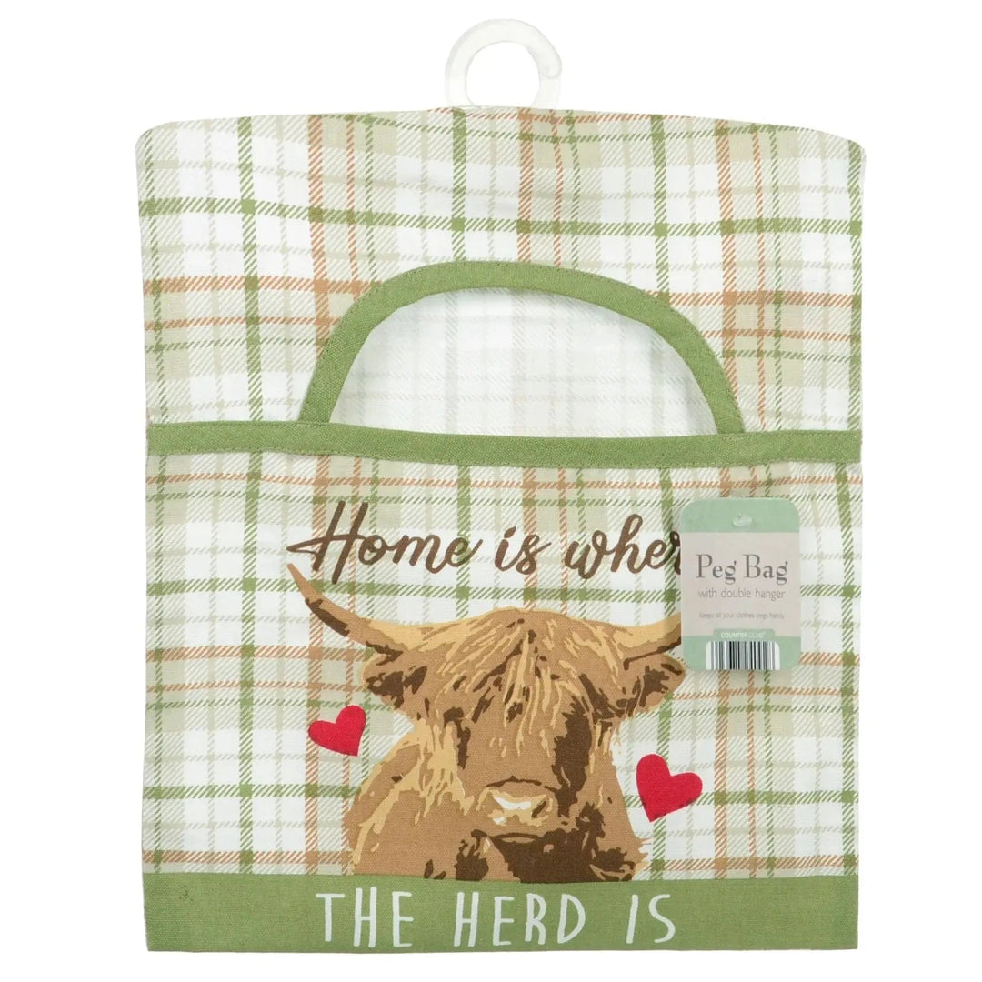Plaid peg bag with a highland cow design and text 'Home is where the herd is' on a white background