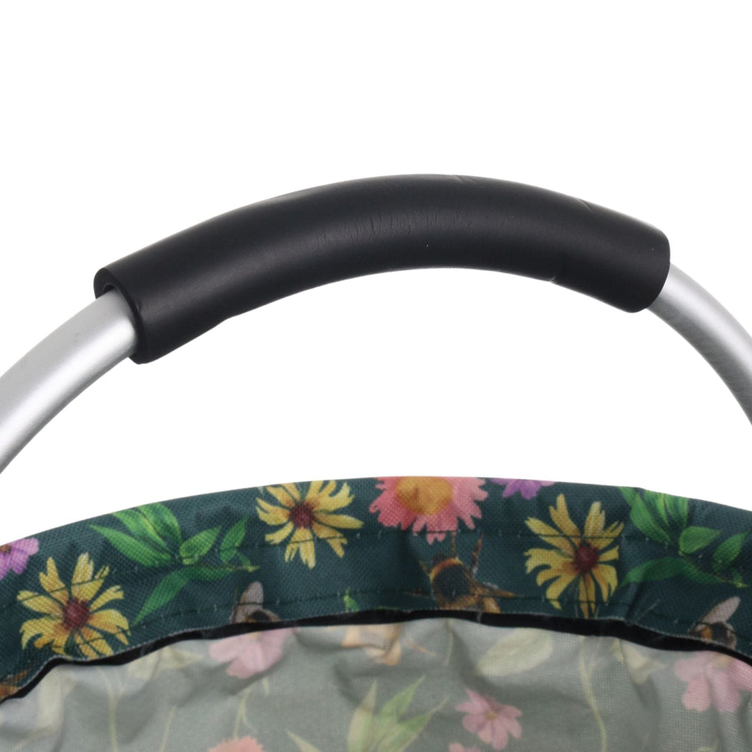Close-up of a floral-patterned garden caddy with a black handle on a white background