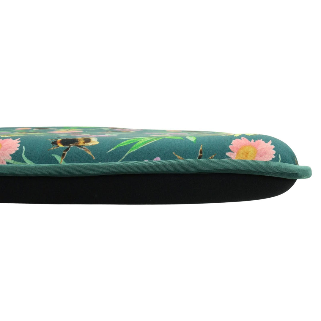 side view of kneeling mat with floral patterned top and all black, solid reverse