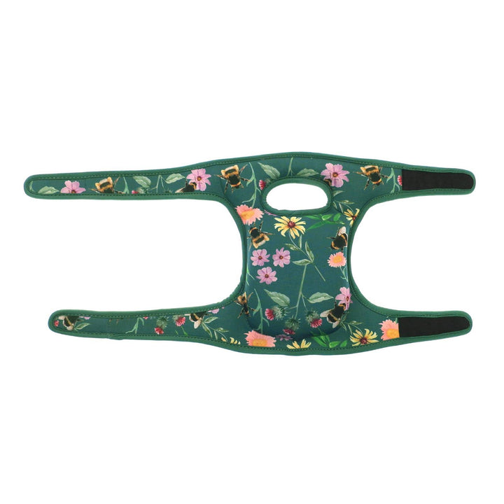 green cushioned knee pads with hook and loop straps fully extended on white background