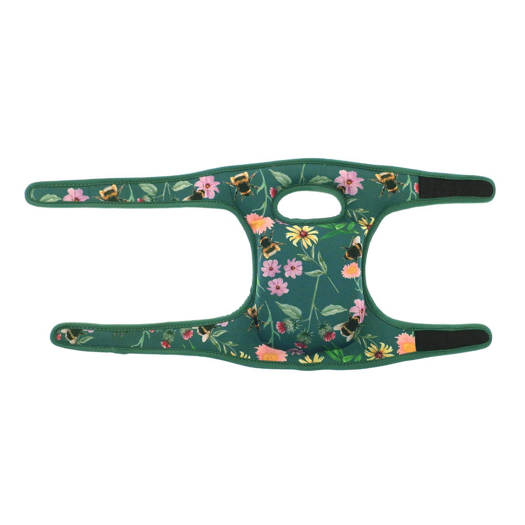 green cushioned knee pads with hook and loop straps fully extended on white background
