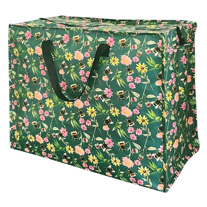 A green fabric storage bin with a dense floral and bee print, featuring dark green handles, shown on a plain white background.