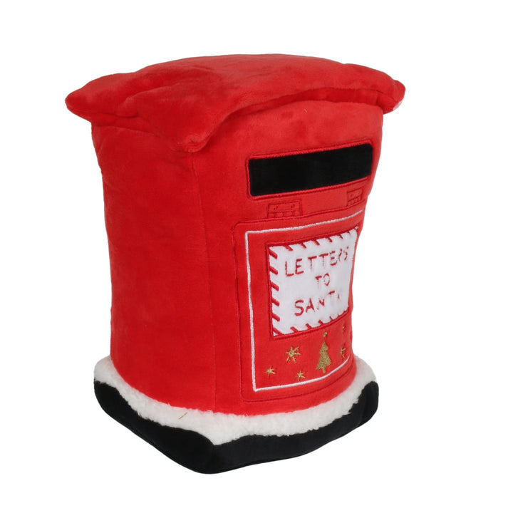 A red plush Christmas mailbox, with a black top slot, a white patch reading &