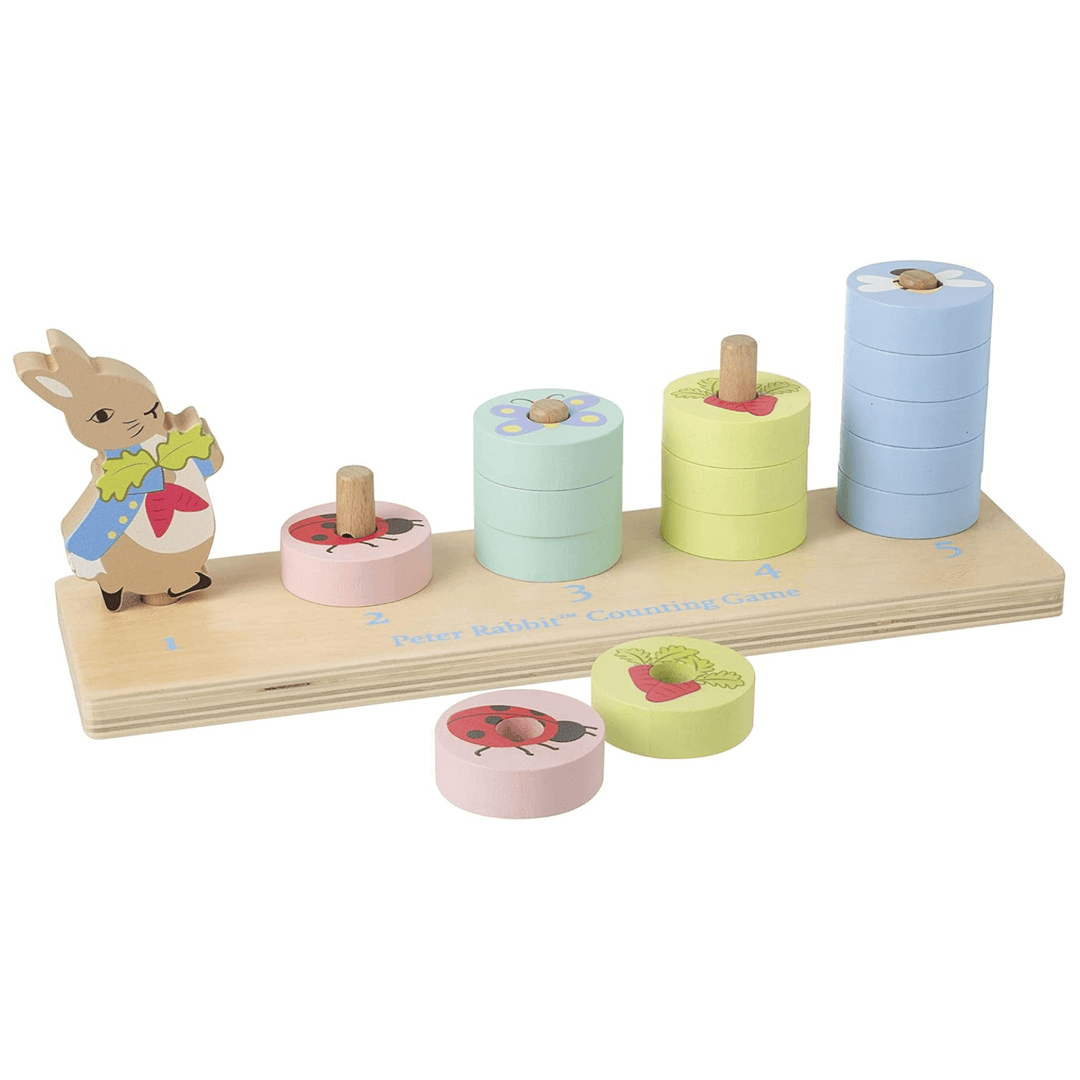 peter rabbit wooden counting game with pastel coloured (pink, greens and blue discs) on wooden board with peter rabbit character and blue coloured writing