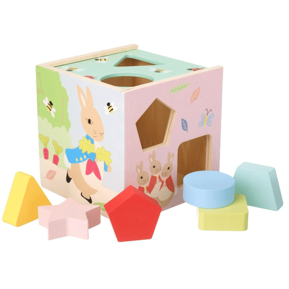 alternative side of wooden shape sorter toy featuring peter rabbit character illustration in pastel colours with pink star, yellow triangle shapes