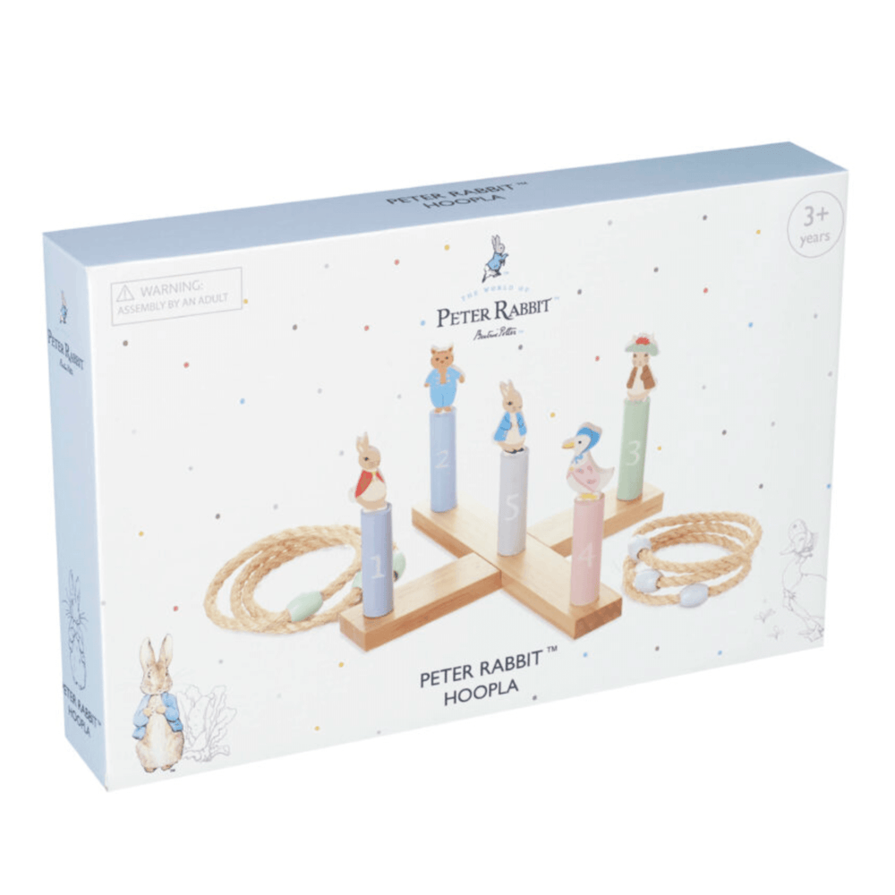 front view of peter rabbit hoopla game packaging in pale blue and white colour with pastel polka dots all over