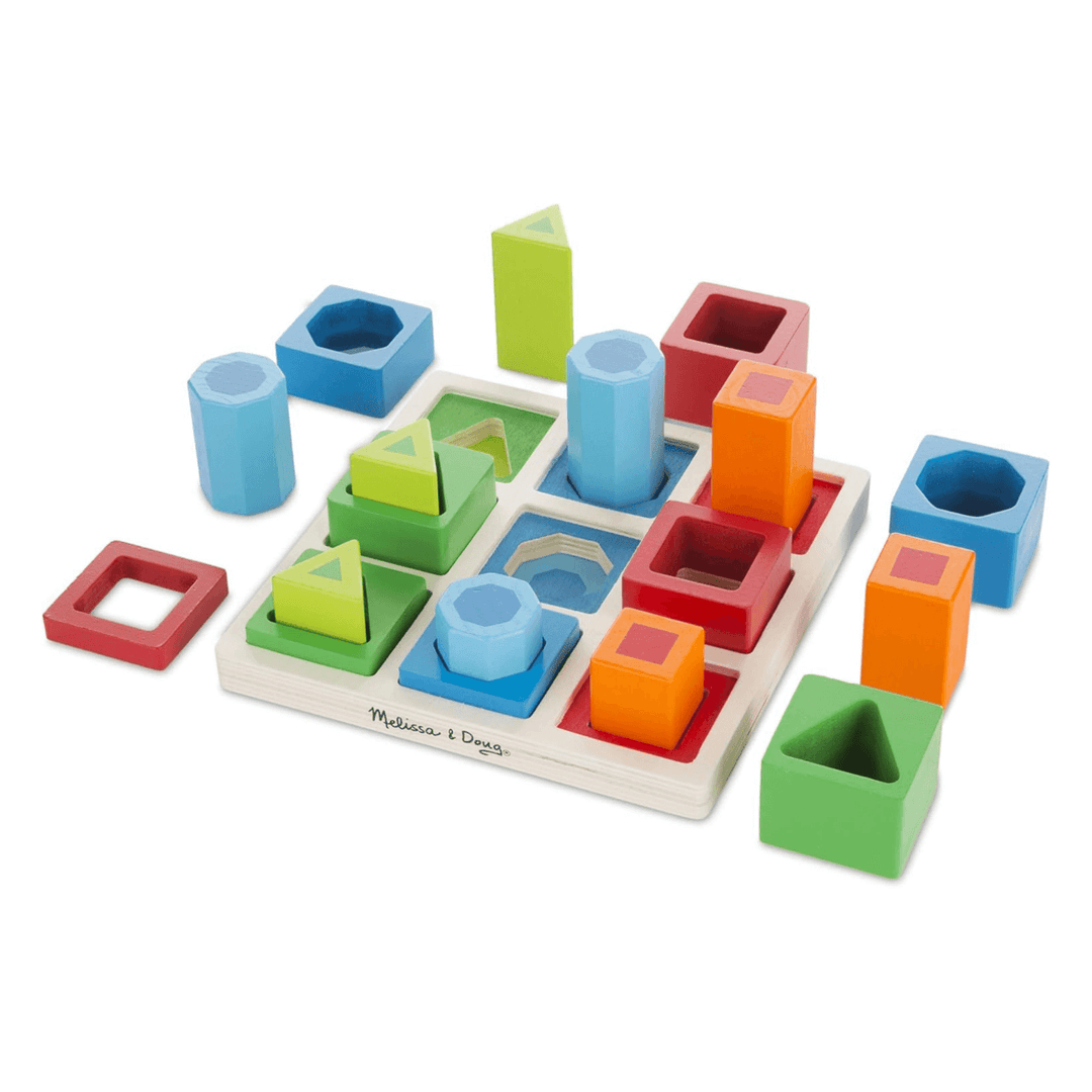 wooden shape sorted set with frame and blocks in various shapes, sizes and colours on white background