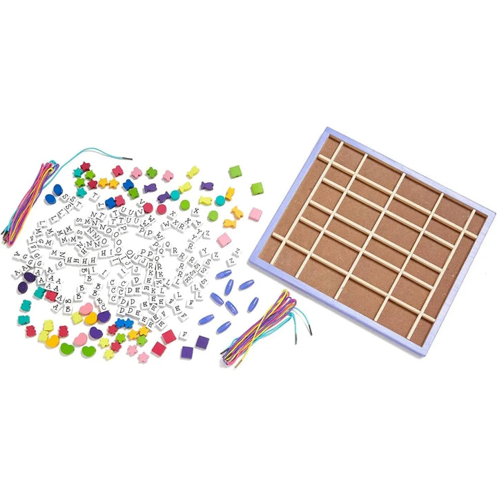 Contents of an alphabet bead kit with wooden tray for storage