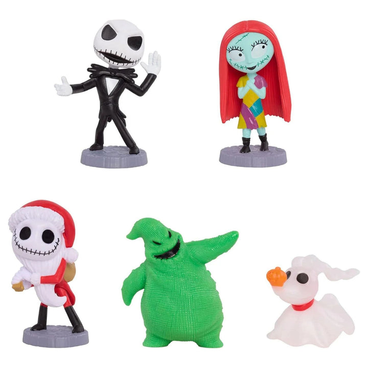 Five small figurines from The Nightmare Before Christmas arranged on a white background: Jack Skellington, Sally, Christmas Eve Jack, Zero, and Oogie Boogie.