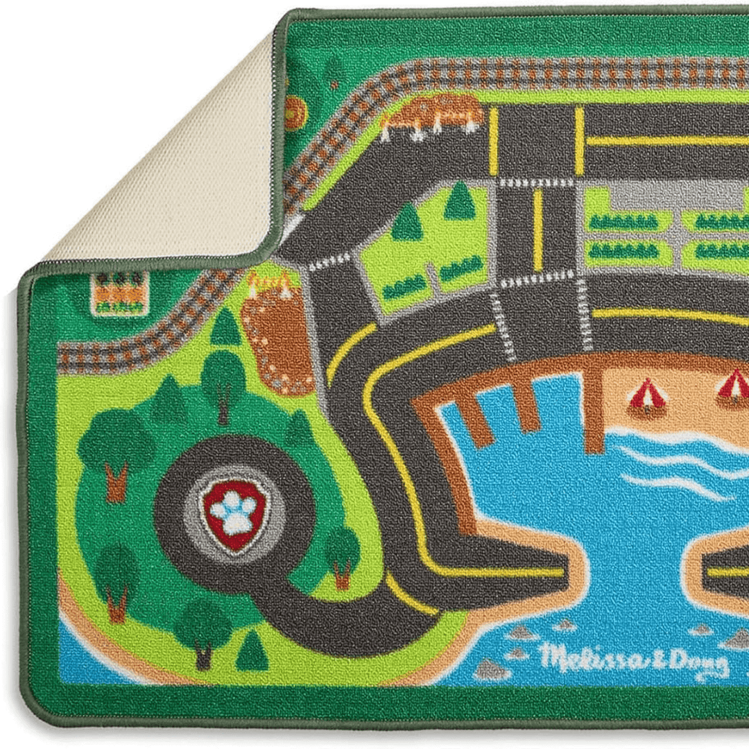 activity rug with corner folded over to show slip resitant backing and reinforced borders to prevent fraying