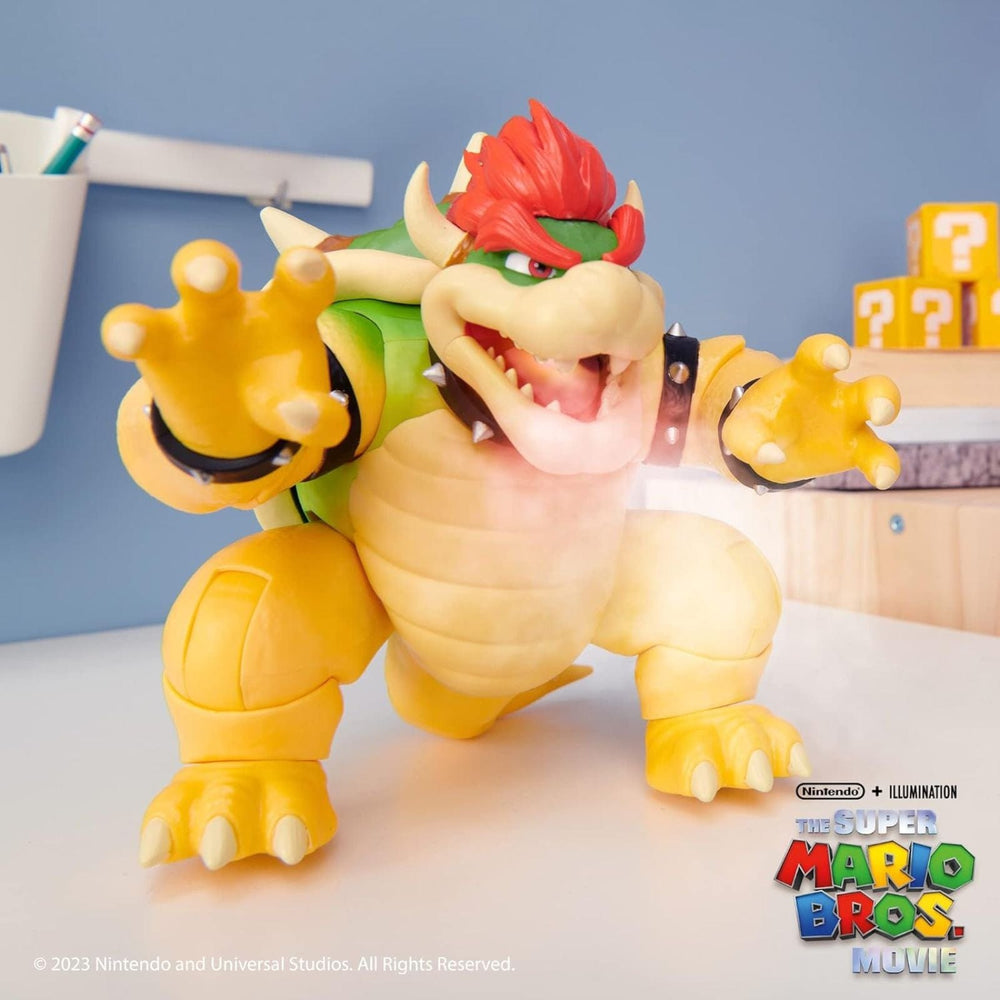 Toy figure of Bowser from Super Mario on a light surface with a blue background and illuminated fire breathing effect