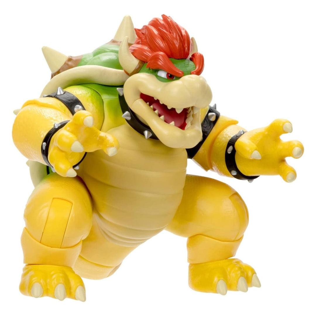 Side view of toy figure of Bowser from Super Mario on a white background
