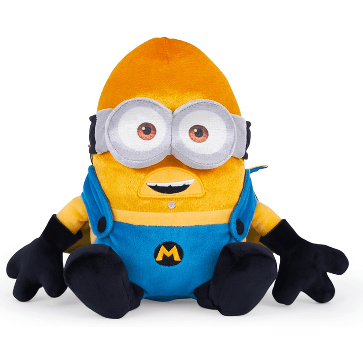 front view of mega gus soft toy with blue plush overalls, 3D googles and black gloves and shoes