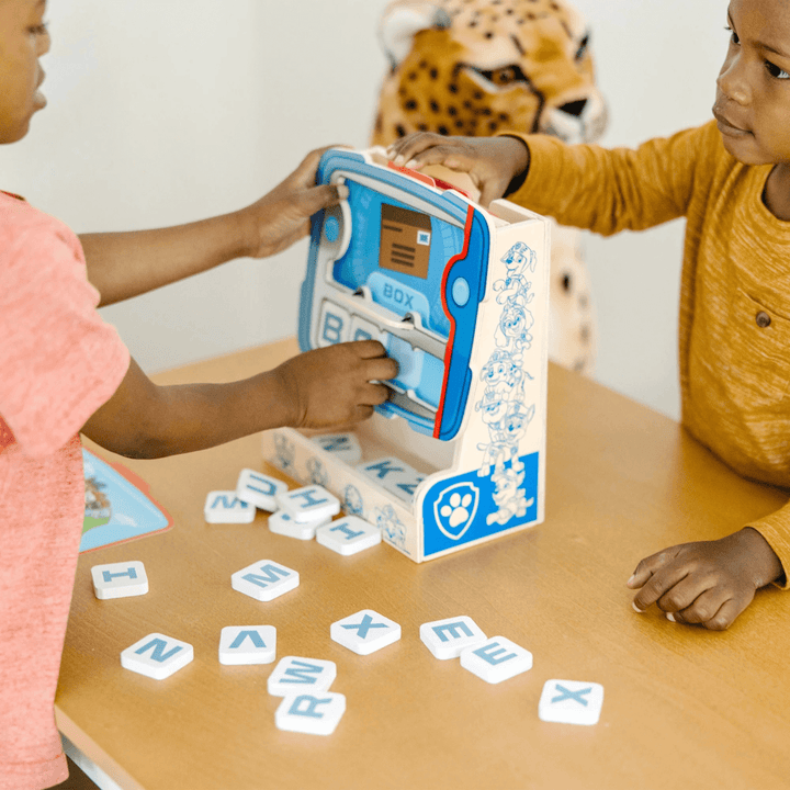 little boy and girl play together to spell the words on the screen - 3 letter word - box