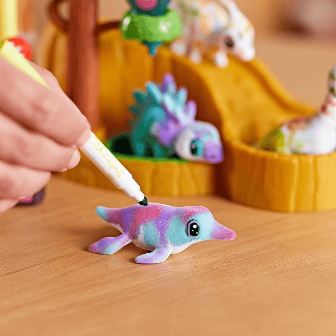 crayola marker colouring in dolly seal on table