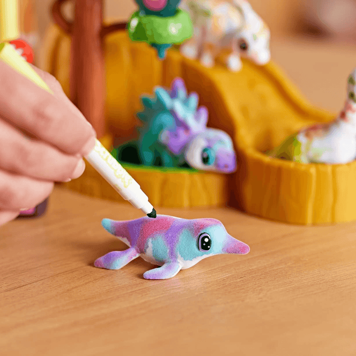 crayola marker colouring in dolly seal on table
