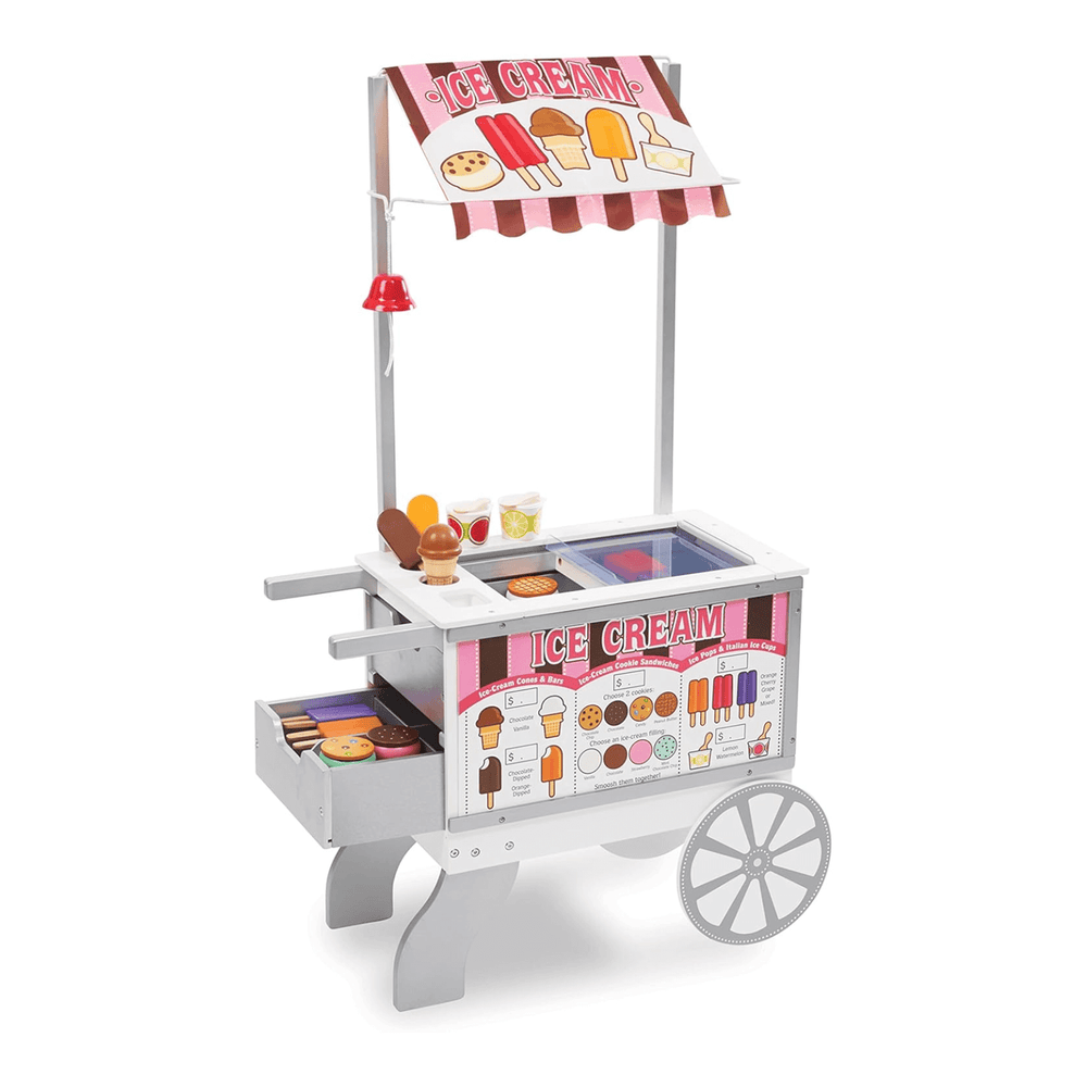 wooden ice cream stand with ringing bell, pretend food and fabric awning in pink and brown colours with wooden wheel and storage drawers