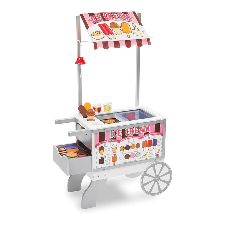 wooden ice cream stand with ringing bell, pretend food and fabric awning in pink and brown colours with wooden wheel and storage drawers