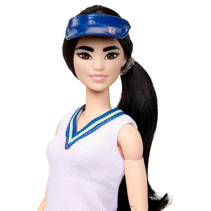 Close up of Barbie tennis player fashion doll with sun visor