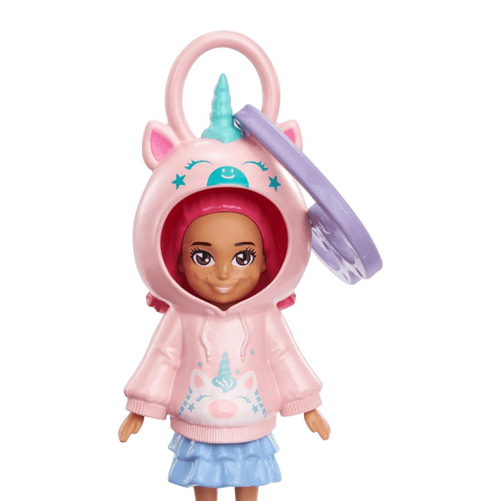 detail shot of polly pocket doll weaering pink hoodie with unicorn details and purple clip heart attached to hanging loop