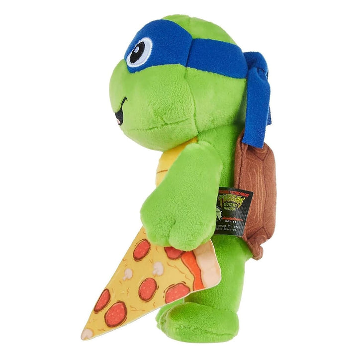 Side view of a plush Teenage Mutant Ninja Turtle with slice of pizza