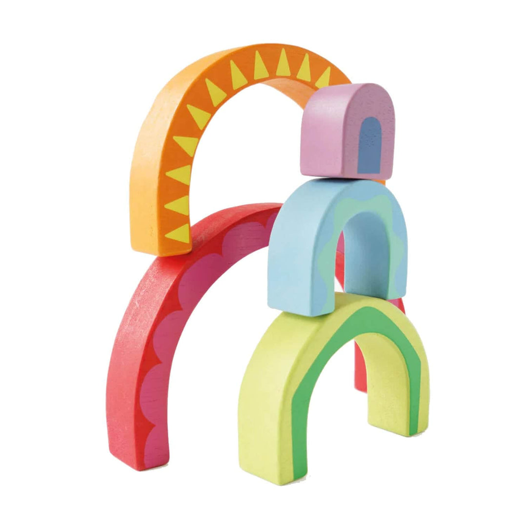 Colourful wooden arch-shaped toy blocks on a white background